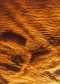 Low angle view of sea against sky during sunset