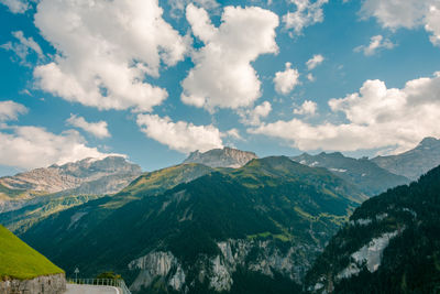 Scenic view of mountains against cloudy sky