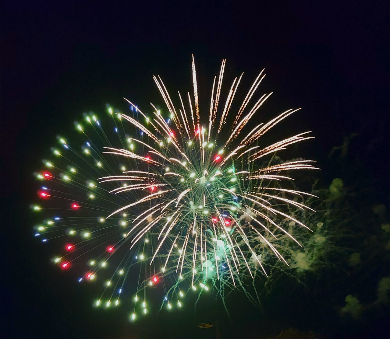 fireworks, celebration, night, illuminated, firework display, event, motion, exploding, arts culture and entertainment, glowing, multi colored, sky, long exposure, firework - man made object, no people, recreation, nature, low angle view, blurred motion, outdoors, light, new year's eve, dark