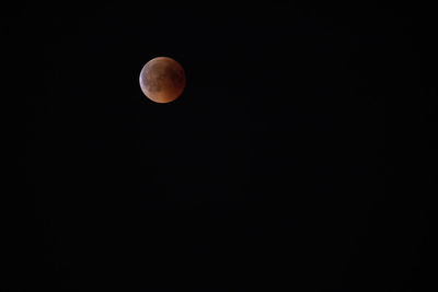 Low angle view of moon against sky at night