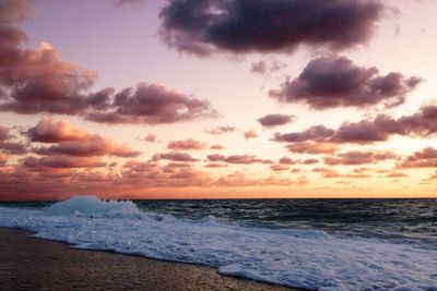 Scenic view of sea against cloudy sky