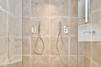 Low angle view of shower head in bathroom