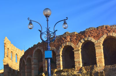 Low angle view of street light against sky