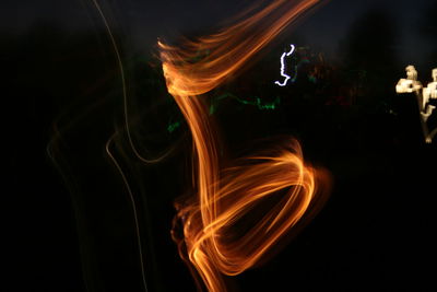 Blurred motion of fire over black background