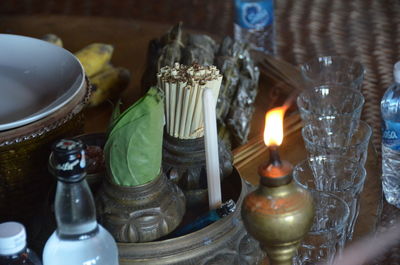 High angle view of diya with weed on table