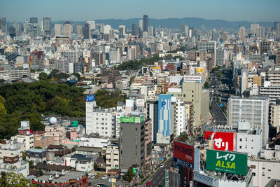 High angle view of buildings in city against sky