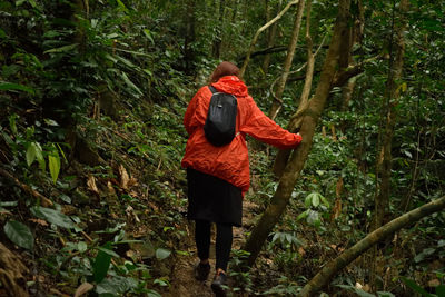 Woman hiking in forest