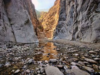 Scenic view of stream flowing through rocks