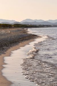 Scenic view of beach against clear sky