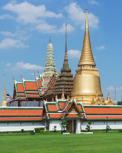 View of temple building against cloudy sky