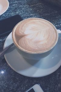 Close-up of cappuccino on table