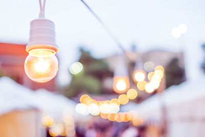Low angle view of illuminated light bulb