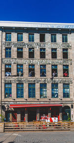 Low angle view of building against clear blue sky