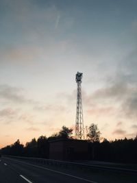 Silhouette of tower against sky during sunset