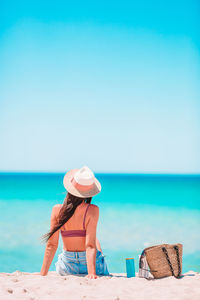 Full length of woman on beach against sky