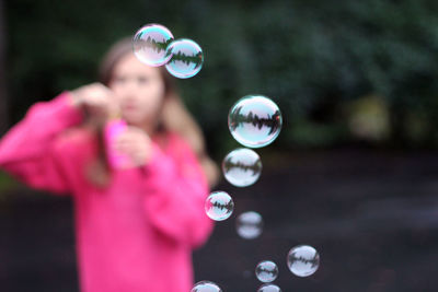 Close-up of bubbles against blurred background