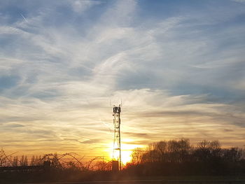 Silhouette landscape against dramatic sky