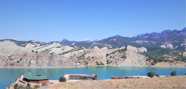 Panoramic view of lake against blue sky