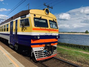 Train on railroad track against sky