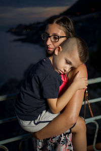 Portrait of mother and daughter outdoors