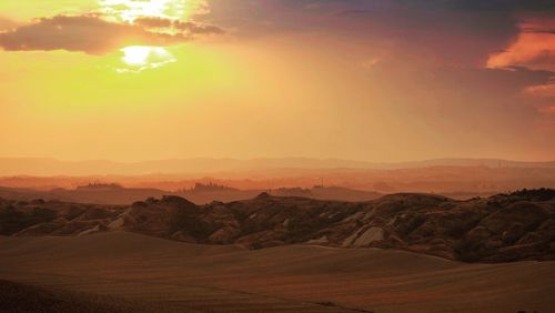 Scenic view of dramatic sky over sea during sunset