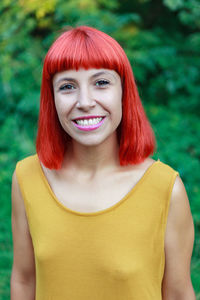 Portrait of smiling woman standing outdoors