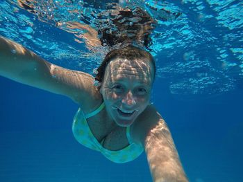 Portrait of man swimming in sea