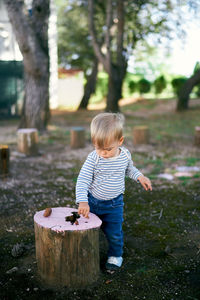 Full length of boy standing on land