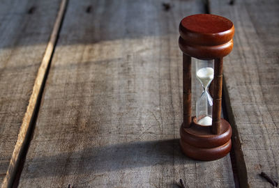 High angle view of clock on table