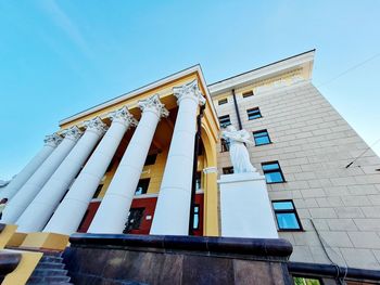 Low angle view of building against clear blue sky