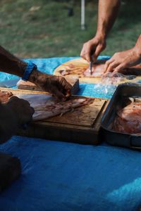 Cropped hand of person preparing food