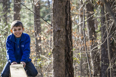 Portrait of young woman in forest