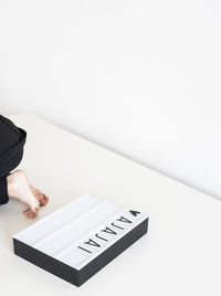 Midsection of woman on white background