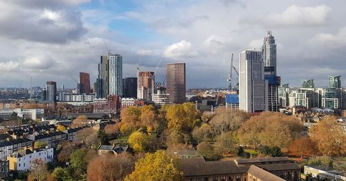 Panoramic view of buildings in city against sky