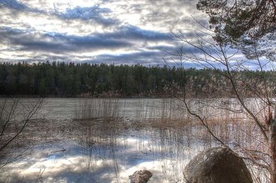 Scenic view of landscape against cloudy sky