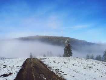 Scenic view of mountains against sky during winter