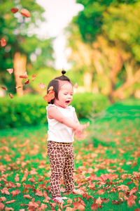 Full length of cute baby girl standing on land