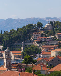 Buildings in town against sky