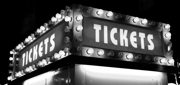 Low angle view of illuminated neon sign