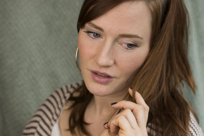 Close-up of thoughtful young woman looking away