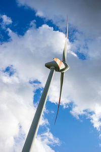 Low angle view of street light against blue sky