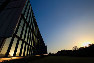 Low angle view of modern building against clear sky