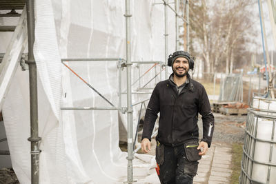 Portrait of male construction worker at construction site