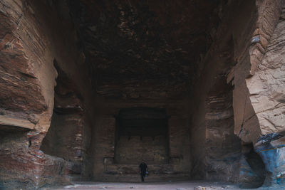 Man standing in cave