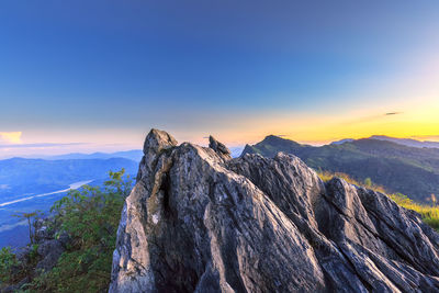 Scenic view of mountains against sky during sunset