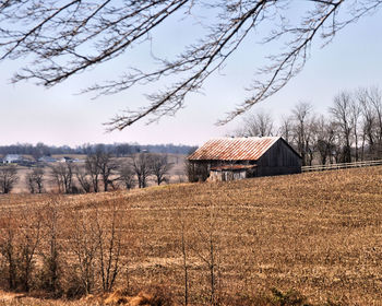 House on field against sky