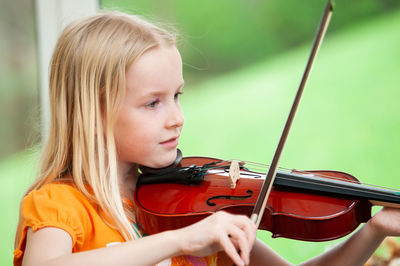 Portrait of girl playing in the background