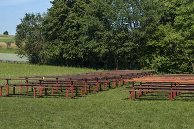 Picnic tables and benches on grassy field