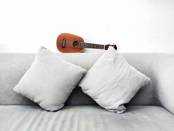 Guitar on sofa at home
