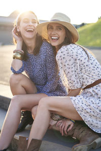 Happy couple sitting on steps